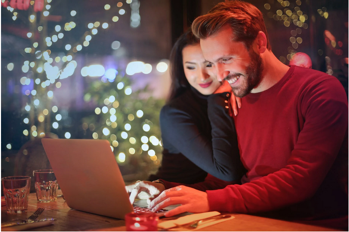 a man and woman playing in an online casino